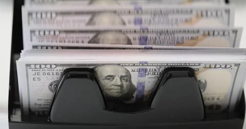 Money counting machine processes stack of dollar bills Stock Footage 301043484