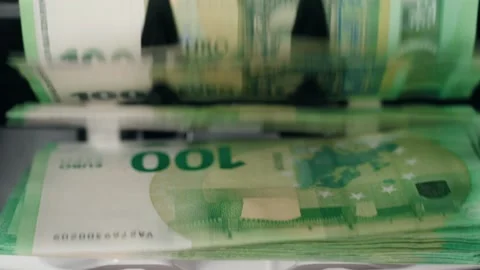 Money counting machine processes stacks of 100 euro banknotes, showing the Stock Footage 333979084