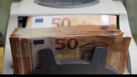 Money counting machine processing stack of 50 Euro banknotes Stock Footage 336205853