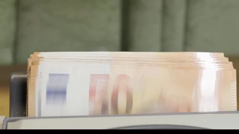 Money counting machine processing stack of 50 Euro banknotes Stock Footage 336206083