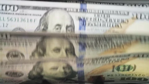 Money counting machine. slow mo movement of 100 USD banknotes Video stock 228070945