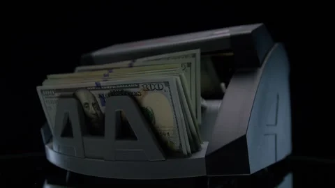 Money counting machine with stacked dollar bills Stock Footage 332855212