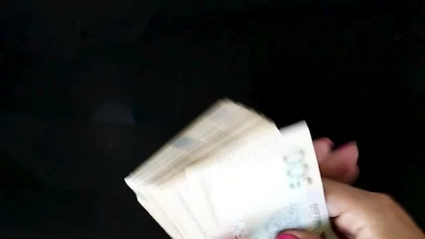 Money Counting. Women's Hands Count Hryvnia Banknotes on a Dark Background.  Stock Footage 246544920