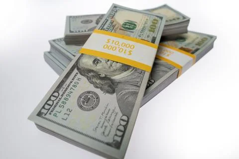 Money in dollar stacks on white isolated background. Money in dollar bill b.. Stock Photos