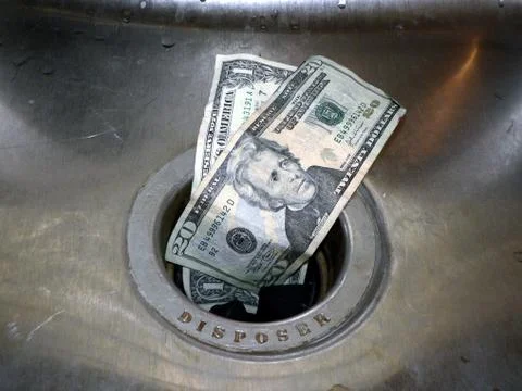 Money down the drain 2 Stock Photos