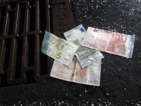 Money down the drain Stock Photos