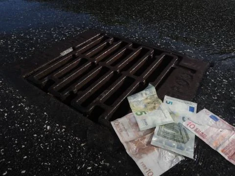 Money down the drain Stock Photos