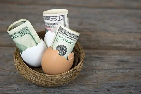 Money in egg shells Stock Photos