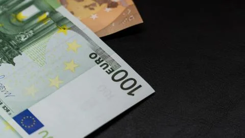 Money in an envelope on a black notepad background Stock Photos