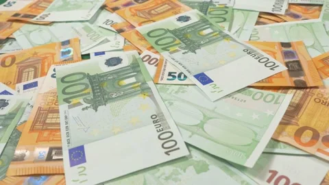 Money euros falling on a table Stock Footage 236700264