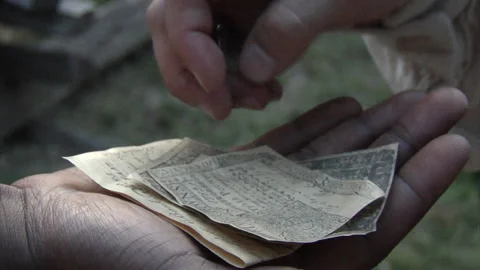 Money exchanging hands in a historical setting, Paper bills and Coins Stock Footage 150828523