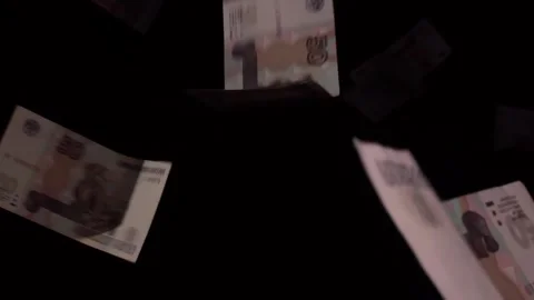 Money is falling on a black background Stock Footage 286838233