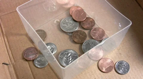 Money falling into a box Stock Footage 297758