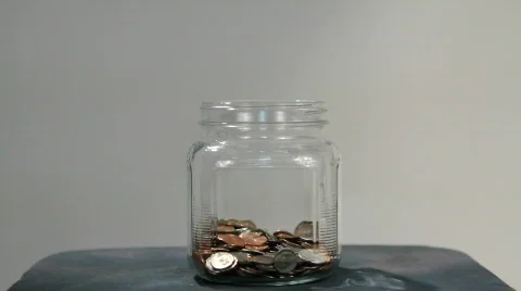 Money Falling In Jar Stock Footage 846783