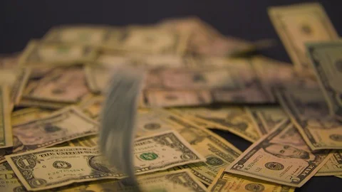 Money Falling into a Pile Stock Footage 94158576