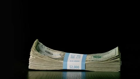 Money Falling On To A Table Stockbeeldmateriaal 295155248