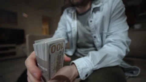 Money Fanning Gesture With Dollar Stack Stock-Footage 323780545