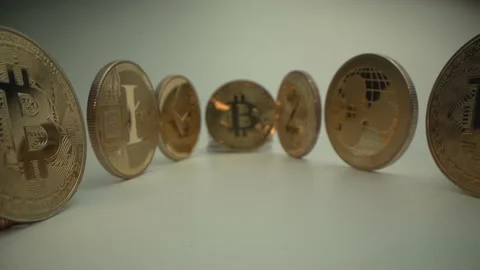 Money. Gold cryptocoins on the white surface. Macro shot. Camera move to main Stock Footage 134530328