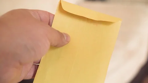 Money -  Hands holding an envelope with $100 dollar bills  Stock Footage 123734895