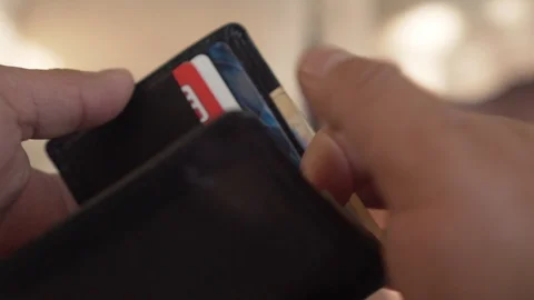 Money - Hands opening a wallet with mexican pesos bills Video stock 123733900