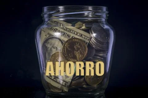 Money jar with AHORRO text Stock Photos