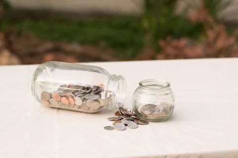 Money in a jars Stock Photos