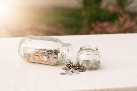 Money in a jars Stock Photos