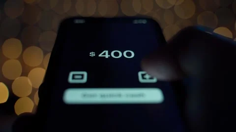 Money lent through a mobile app, close-up against a garland. Choosing the amount Stock Footage 311404402