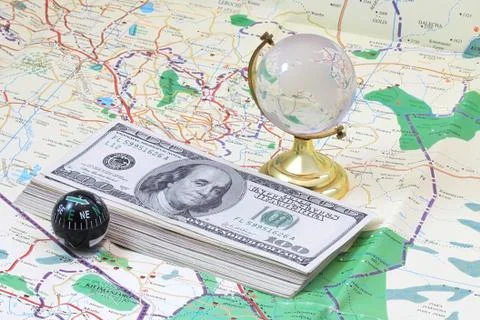 Money lying on the map Stock Photos
