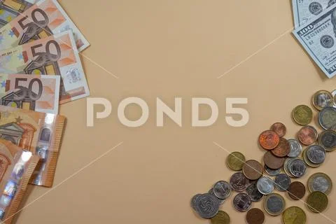 Money lying on yellow backgroud. Coins and bills concept of success Stock Photos