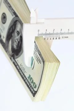 Money measuring Stock Photos