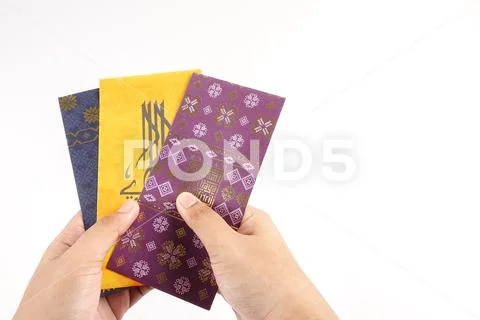 Money packet during Eid Fitr on white. Arabic characters means Happy Eid Muba Stock Photos