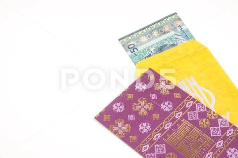 Money packet during Eid Fitr on white. Arabic characters means Happy Eid Muba Stock Photos