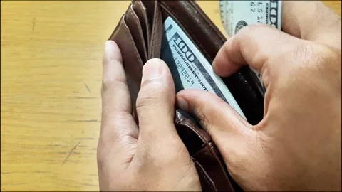 Money pulling out rupiah note from a wallet Stock Footage 288975340