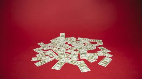 Money on a red background. Stock Photos