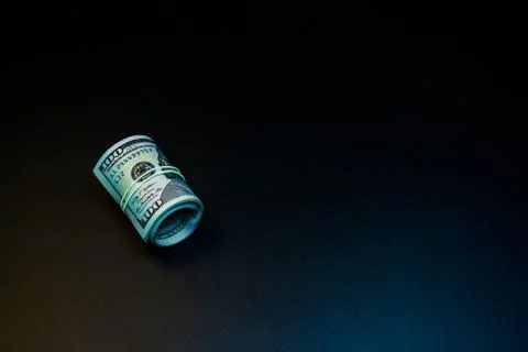 Money roll on the black background Stock Photos