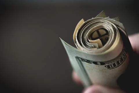 Money rolled Stock Photos