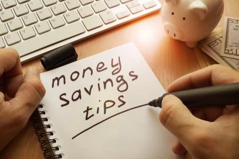 Money saving tips written in a note. Stock Photos