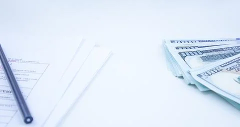Money Stack and Pen on Table. Stock Photos