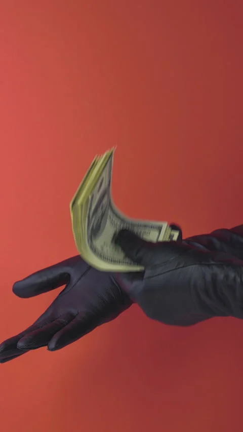 Money Stack Applause with black leather gloves on red background Видео 268851652