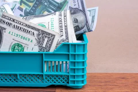 Money stack in basket Stock Photos
