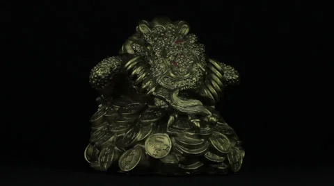 Money toad rotates on a black background loop Stock Footage 34660606