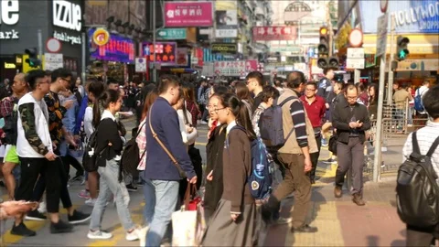 Mongkok busy crossing intersection crowded people shopping slow mo Stock Footage 81212301