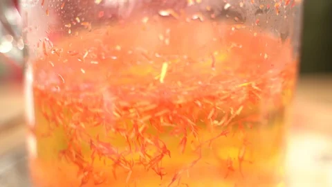 Mongolia 030 Orange tea leaves in water Stock-Footage 128400207