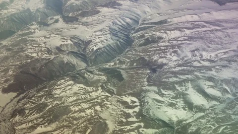 Mongolia aerial view of mountains covered with snow in the spring stock footage Stock Footage 75949296