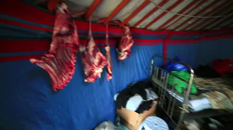 MONGOLIA - JUNE 2013: mongolian people drying Meet inside ger camp Stock Footage 32425331