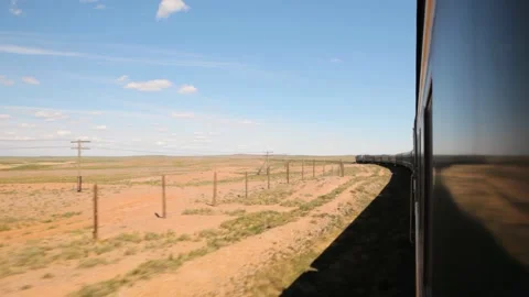 Mongolia Trans Siberian train ride through desert view from window, wagon 動画素材 196674528