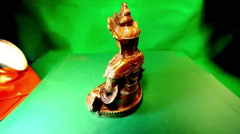 Mongolian Iron Figure Spin on Green Background Stock Footage 62635749