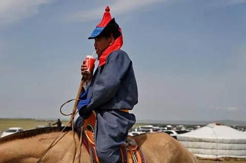 Mongolian rider drinking Cola Stock Photos