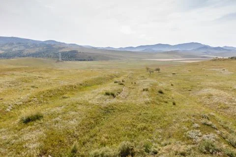 Mongolian steppe on the background of a cloudy sky Stock Photos